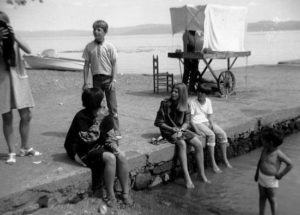 The lake was the focus of most activity. A popular pastime for the younger brigade, especially in the late afternoon, was sitting on the pier, feet dangling in the water, chatting and deciding what to do next. ﻿Photo in personal collection of Tamara Johnson. All rights reserved.