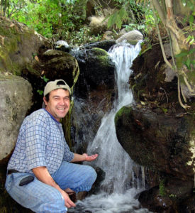 Arturo Reynoso of Tala shows off a surging spring of warm, clean water on the banks of Mexico's River of Ghosts. © John Pint, 2011