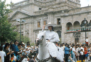 Girl in escaramuza dress, the female counterpart to a charro