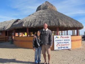 Expat Duke Wild and his Mexican wife Lupita in front of her restaurant in Baja, Mexico © Patti Morrow, 2013