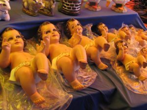 Images of the Niño Dios, or Baby Jesus for sale in a market in Oaxaca © Tara Lowry, 2014