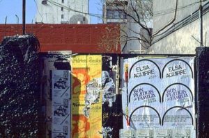 Within the Zona Rosa barricades block the view of vacant lots left from the demolition of earthquake damaged buildings. Photography by Bill Begalke © 2001