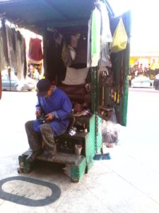 A bolero or shoe-shine man at his station on Avenida Miguel Hidalgo in Tijuana, Mexico © Henry Biernacki, 2012