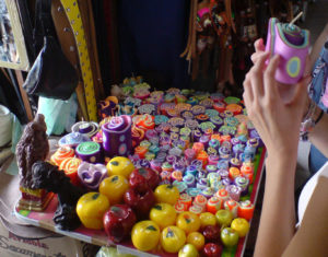 Craftspeople show off their work in the market in Tequisquiapan, Queretaro. These colorful candles are crafted by hand. © Daniel Wheeler, 2009