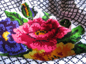 A beautiful rose, created in the style of Michocan's cross stitch embroidery. Colorful images fill the needlepoint garments of Hermelinda Reyes and her family. © Travis Whitehead, 2009 © Travis Whitehead, 2009
