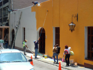 Workers add a splash of color to a colonial building in downtown Cuernavaca. © Anthony Wright, 2009