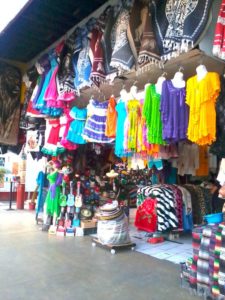 Colorful dresses in gauza and cotton tempt passersby, while ponchos, hats and guitars offer even more options. Shopping is a favorite activity for visitors to Tijuana, Mexico © Henry Biernacki, 2012