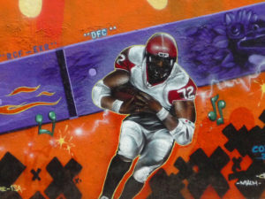 Closeup of an "American football" player from the "Free Style: the DF Chiapas connection" graffiti mural on the Estadio Azteca (Aztec Stadium) in Mexico City. © Anthony Wright, 2009