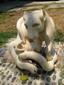 Carved by hand, a fierce cat grapples with a restive snake. This piece exemplifies the imaginative work of Oaxacan artisan Jacobo Angeles. © Alvin Starkman 2008