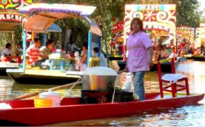 Food vendors on the canal in Xochimilco, Mexico © Edythe Anstey Hanen, 2013