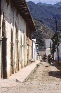 Picturesque adobe homes line a narrow street in Batopilas, Chihuahua one of the most remote towns in Mexico, situated in the Copper Canyon. © Geri Anderson 2001.