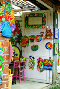 A virtual zoo of animals vie with fruit and flowers for attention. Carved and painted by hand, all kinds of furniture fill the doorways and shops of Cuanajo.