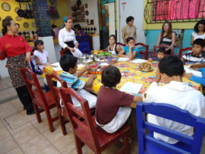 Students at Chef Pilar Cabrera's Casa de los Sabores Cooking School meet their companions in her first class for children at the prestigious culinary school in Oaxaca, Mexico. © Alvin Starkman, 2011