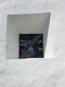 An angel appears in stained glass in Tetelpa's San Esteban Church in Mexico. © Julia Taylor, 2008