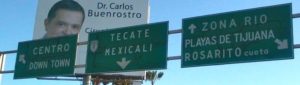 Signs point the way to downtown Tijuana, Mexico, as well as the routes east to Tecate and south to Rosarito. © Henry Biernacki, 2012