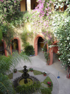 Lush bougainvillea and a placid fountain in the inner courtyard at the Melville Hotel in Viejo Mazatlan. A former mansion built in 1840, the Melville is named for author Herman Melville who once spent a few weeks here. © Carolyn Patten, 2009