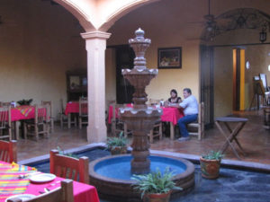 Enjoying sotol in thhe patio of an old Mexican home, now a restaurant © William Kaliher, 2011