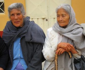 Two elderly women await the midweek meal offered by S.O.M.E (So Others May Eat) in San Miguel de Allende. © Edythe Anstey Hanen, 2013