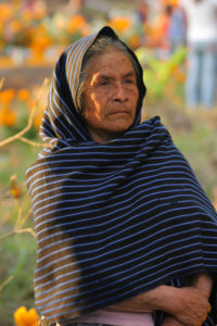 A Purepecha woman stays with her loved ones in Santa Fe de la Laguna, Michoacán. © Yuri Awanohara, 2008