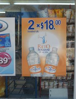 Bottled water at a convenience store for approximately $1.40 USD per bottle of 1.5 liters. © Daniel Wheeler, 2010