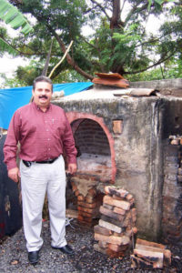 Javier Degollado with the large brick kiln