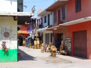 A maze of narrow alleys with stalls set behind roll-up steel doors