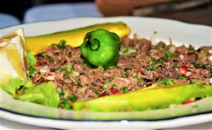 Shredded venison is accompanied with salsas and freshly made tortillas. © 2020 Jane Simon Ammeson