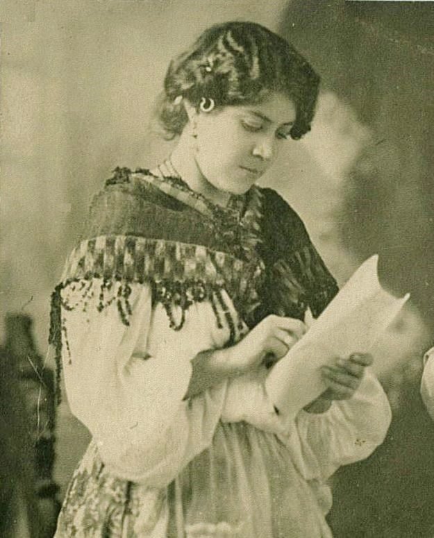 Sini reading her lines for a play in a local theatre.